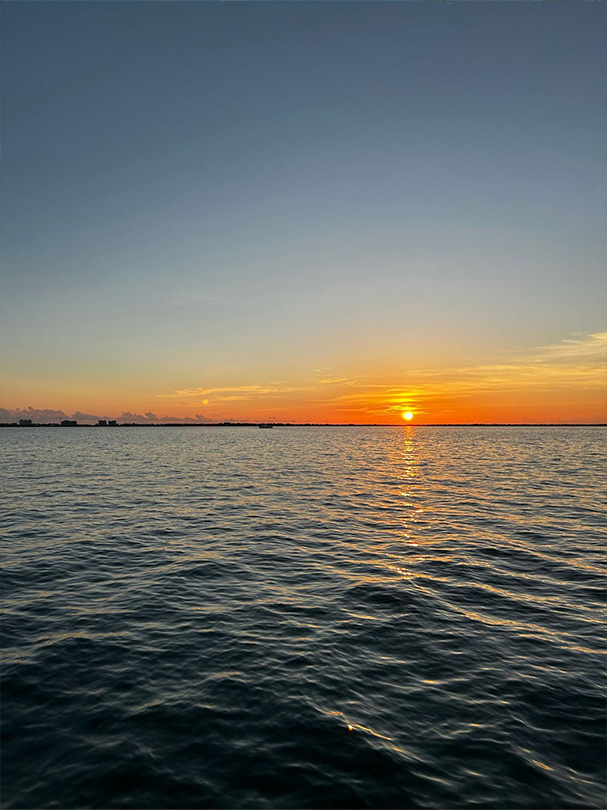 Ocean Sunset at 2023 GAIM Ops Cayman Conference | Hilton Global Associates